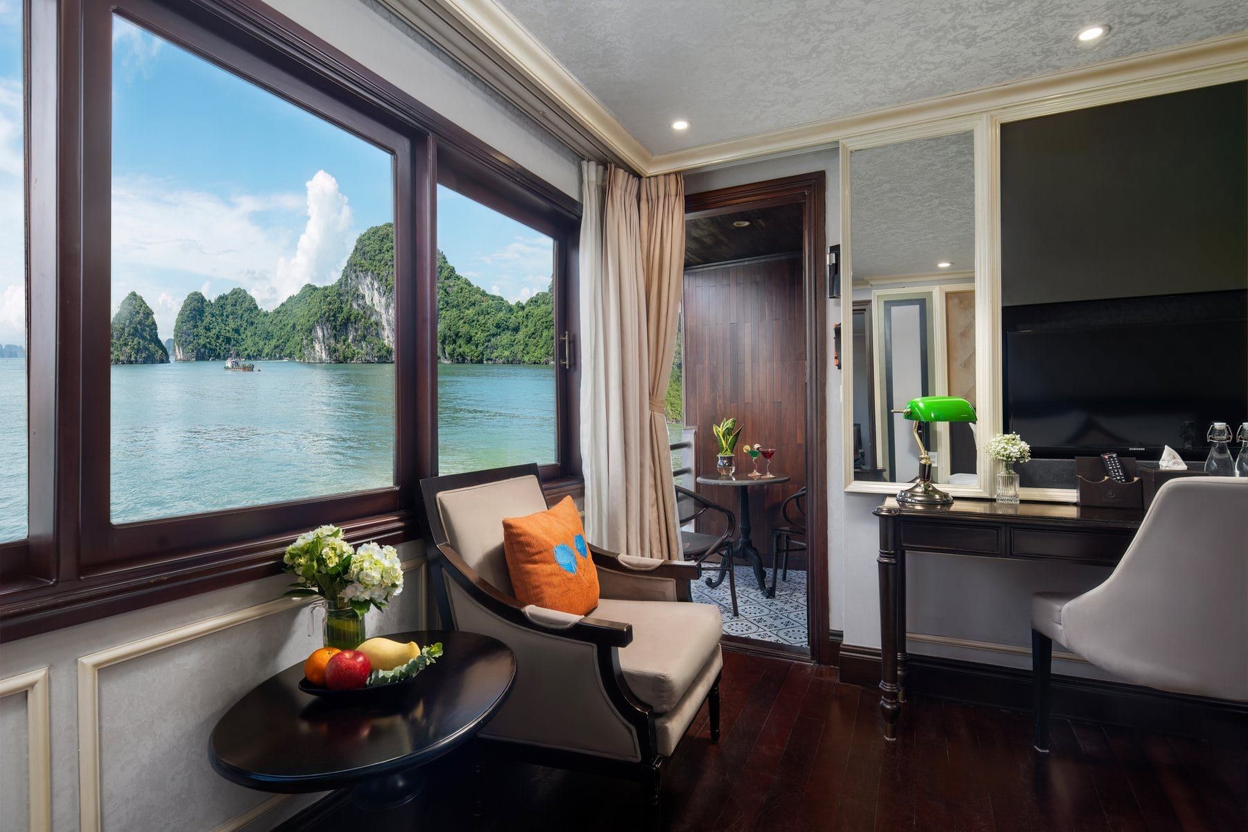 A Deluxe Balcony cabin with the bay framed in the window