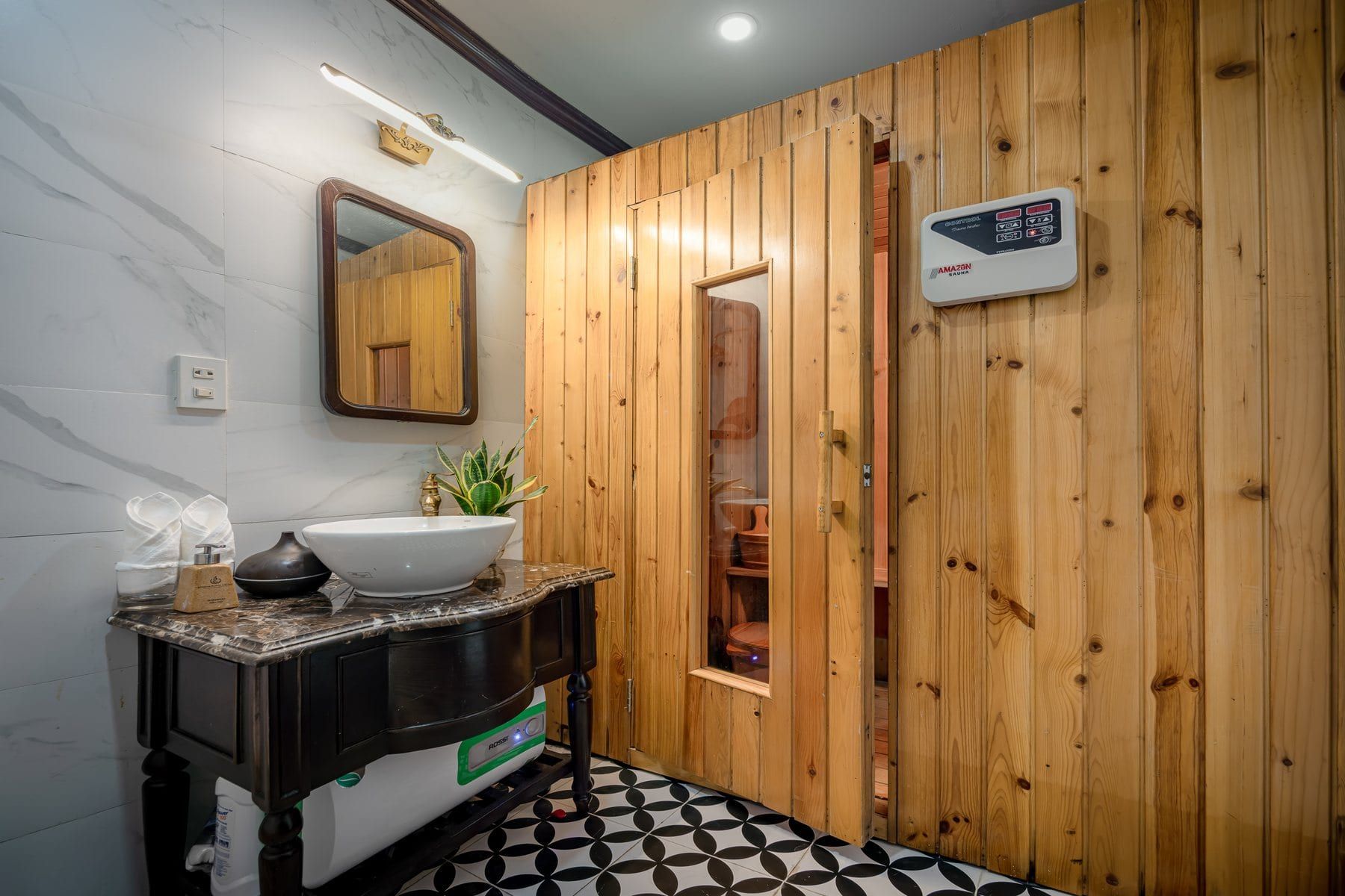 The timber sauna cabin beside the treatment room