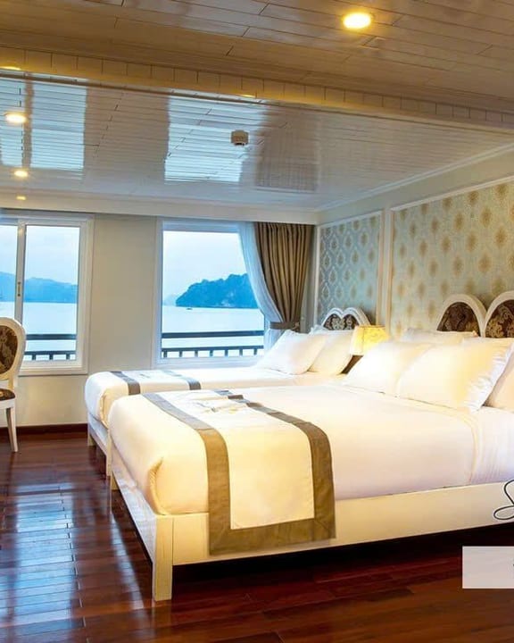 The Exclusive Family Suite aboard Signature Halong, bay windows alongside